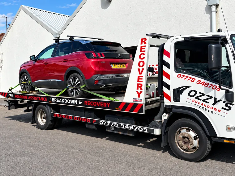 Car on Ozzy’s Breakdown Recovery flatbed truck – car towing in Basingstoke