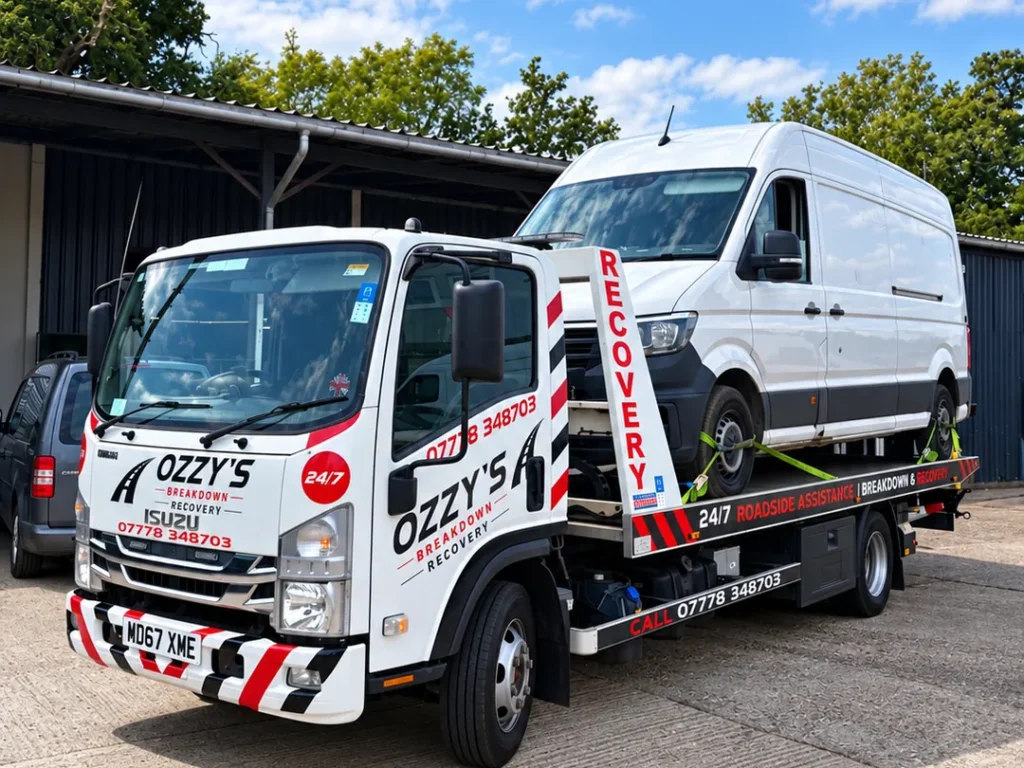Ozzys Breakdown Recovery Isuzu recovery truck Ozzys Breakdown Recovery Ozzys Breakdown Recovery Isuzu truck carrying a white van