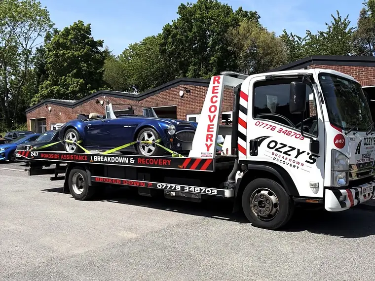 Classic car carried on Ozzy’s Breakdown Recovery flatbed truck