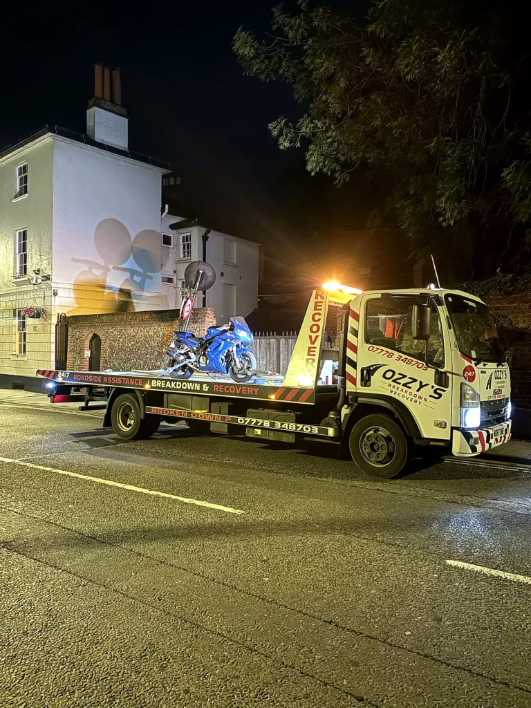 Motorbike strapped onto our truck at night – instant breakdown cover in Burghfield Common by Ozzy’s Breakdown Recovery