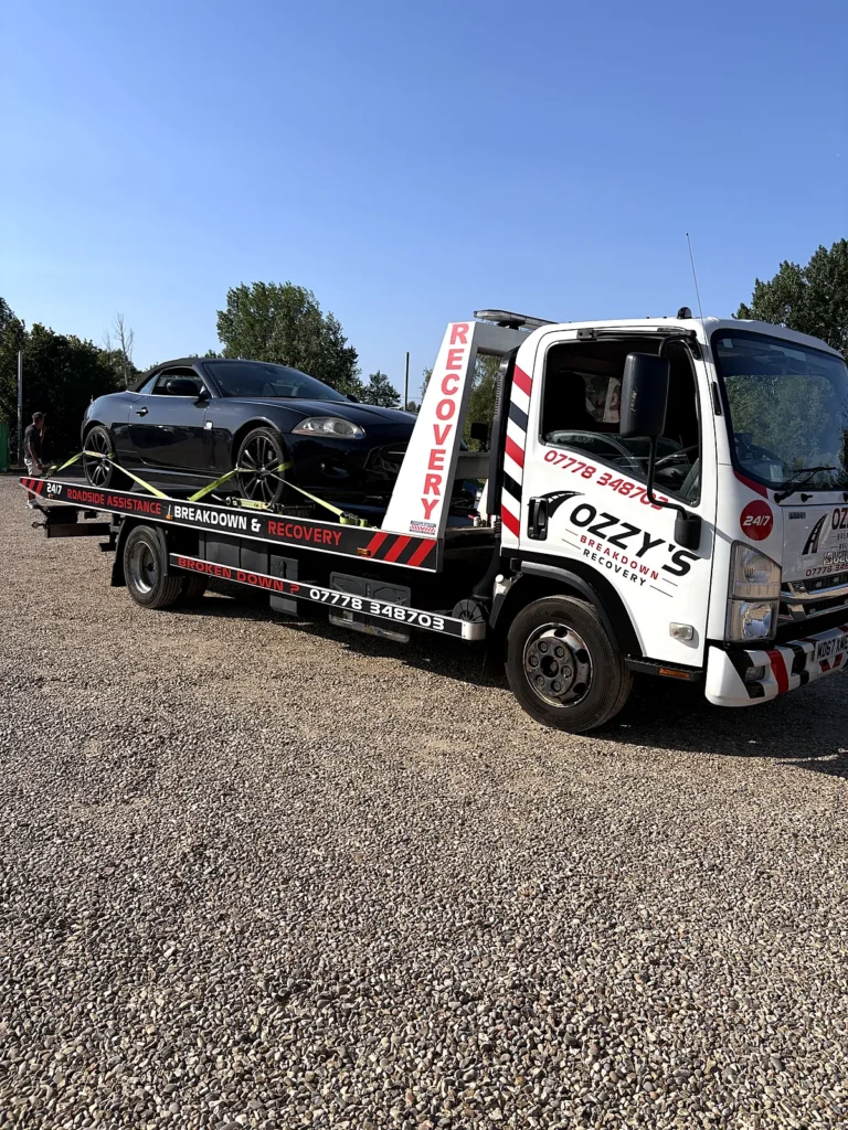 Low sports car loaded onto our flatbed – instant breakdown cover in Berkshire by Ozzy’s Breakdown Recovery
